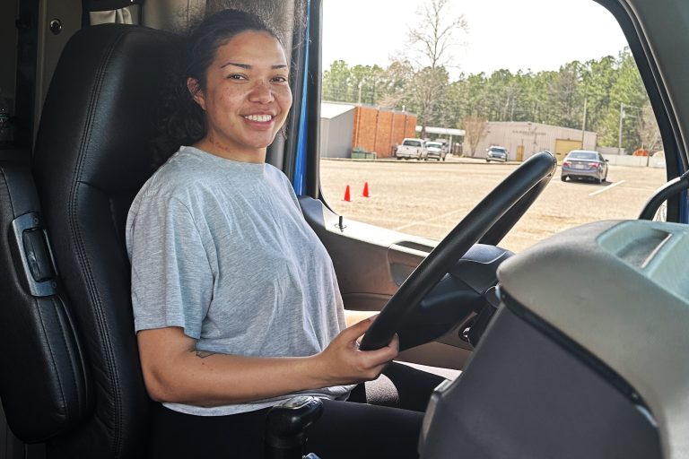 Student sitting in the cab of the truck
